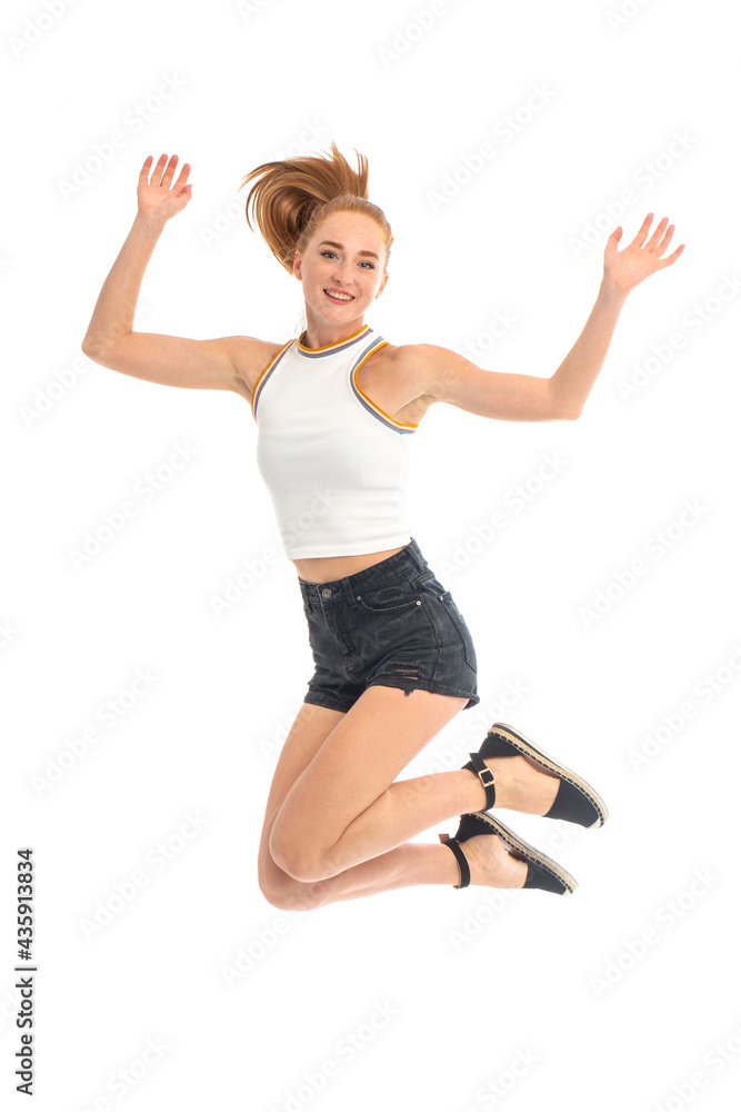 Young beautiful red hair model posing at studio on white background Young beautiful red hair model posing at studio on white background