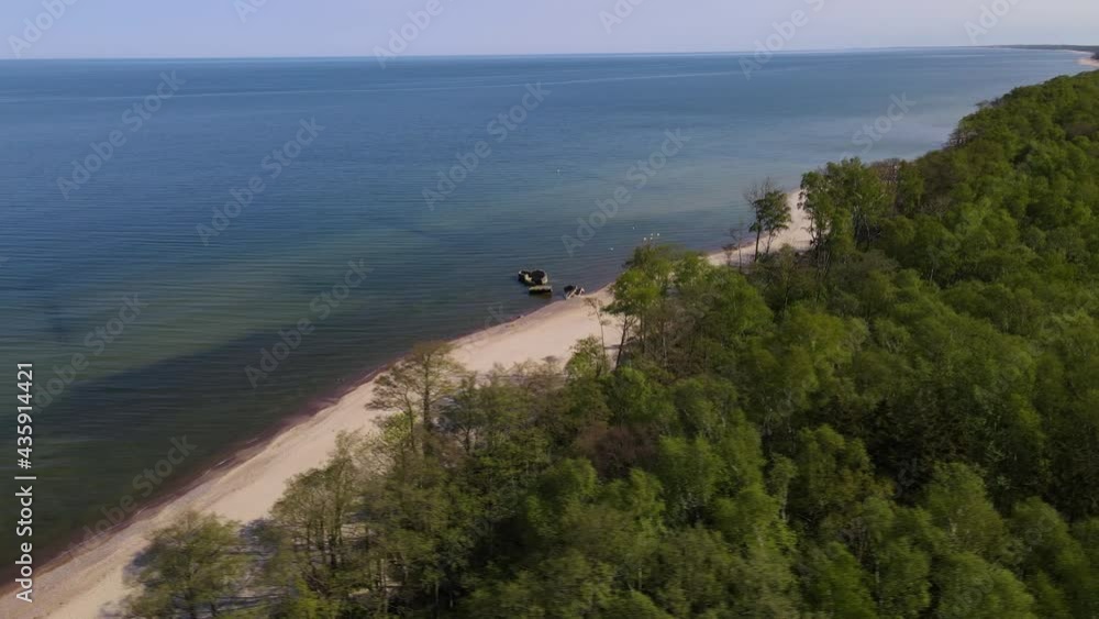 Aerial view of sandy beach, sea and forest on Baltic sea on Curonian spit. top view. 4k drone video Aerial view of sandy beach, sea and forest on Baltic sea on Curonian spit. top view. 4k drone video