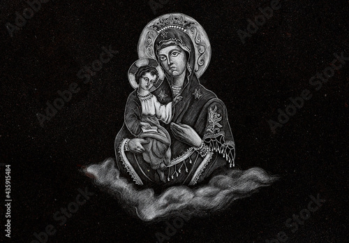 an engraving on black marble representing the virgin Mary with the baby Jesus in the orthodox cemetery in Reghin city - Romania