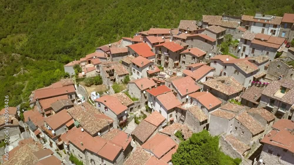The red roofs of the white houses in Petrello Salto Italy on top of the mountains as seen on the aerial view The red roofs of the white houses in Petrello Salto Italy on top of the mountains as seen on the aerial view