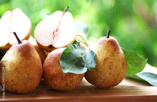 portuguese rocha pears and leaves on table