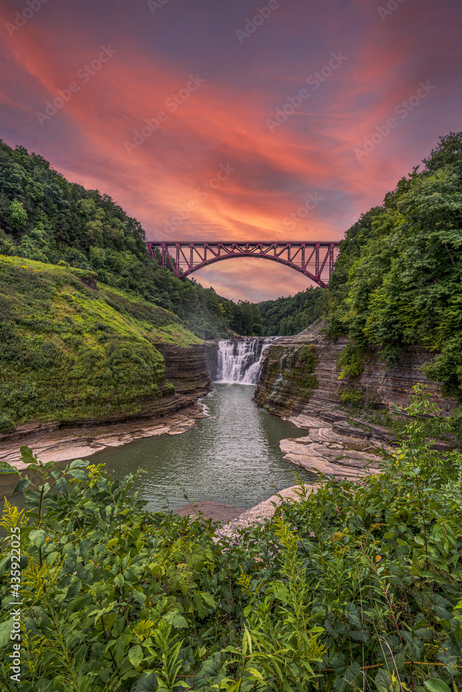 Fototapeta premium Letchworth state waterfall and bridge at sunset