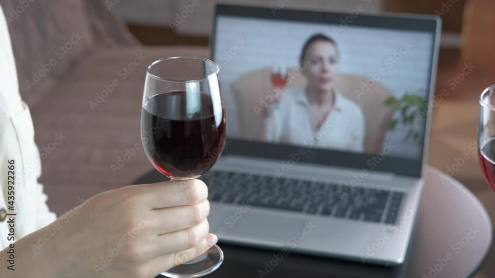 Celebration online with wine. A remote home pary with a notebook and red wine in the room. Celebration online with wine. A remote home pary with a notebook and red wine in the room.