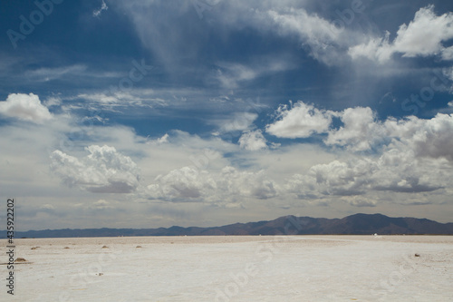 Industrial salt extraction opencast mining. View of the natural salt flat and salt mine under a beautiful sky in Salinas Grandes, Jujuy, Argentina.