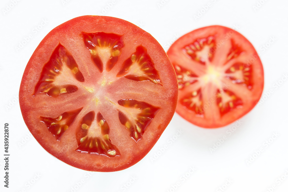 juicy red tomato slice isolated close up of seeds flesh and textures