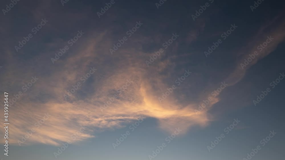 Beautiful cloud transformation backlit by sunset sun Beautiful cloud transformation backlit by sunset sun