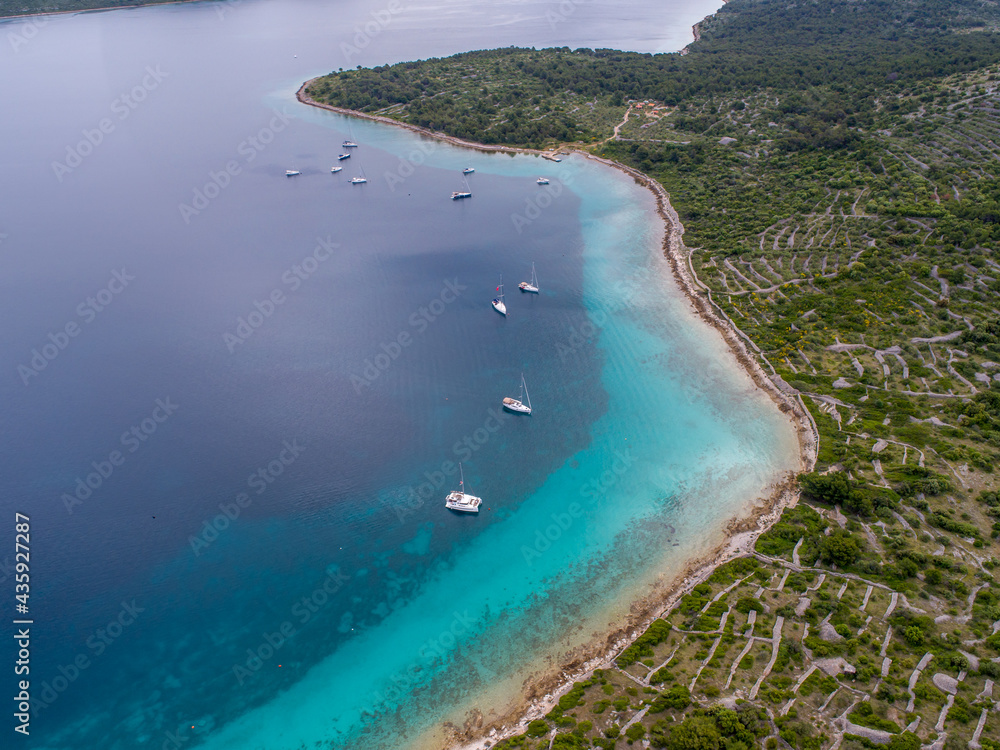 Croatian islands and sailing ships from drone view