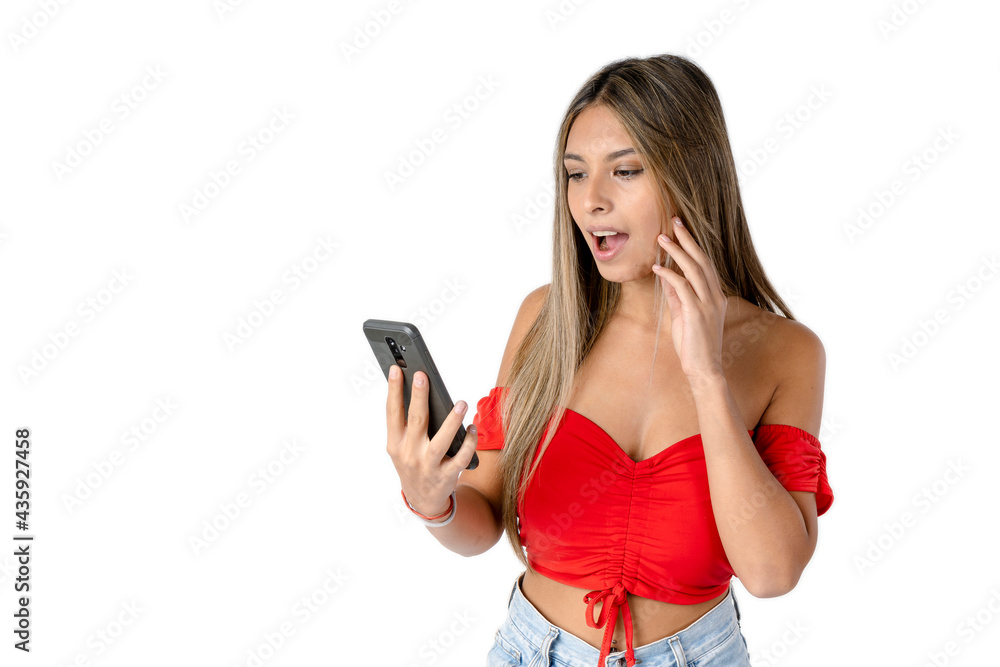 Attractive straight haired woman reading a message on a cell phone or smartphone with a shocked face on a pure white background. studio shot Attractive straight haired woman reading a message on a cell phone or smartphone with a shocked face on a pure white background. studio shot