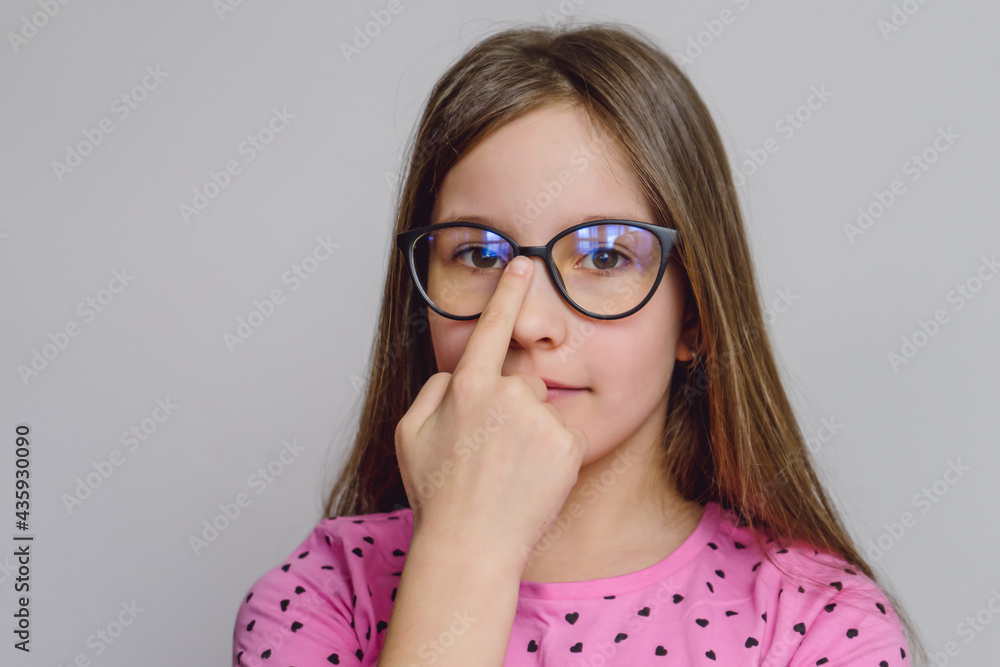 Portrait of a cute beautiful 8 year old girl with glasses Portrait of a cute beautiful 8 year old girl with glasses
