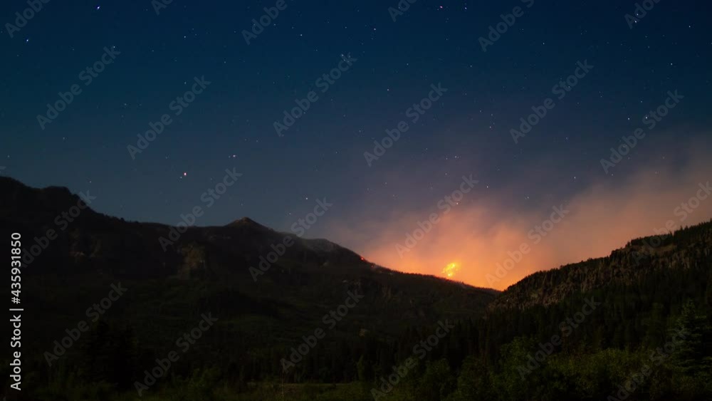 Time-lapse of burning wildfire on a mountain at night Time-lapse of burning wildfire on a mountain at night