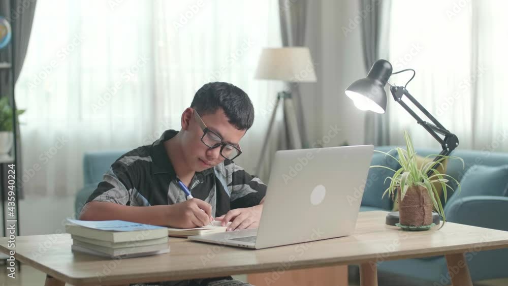 Teenage Boy Learning Online From Laptop At Home
Teenage Boy Learning Online From Laptop At Home