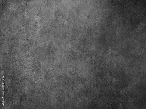 Black and white background image, rough surface, looks like a cement floor.