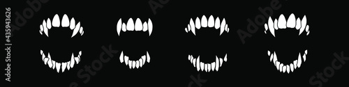Fototapeta Vampire teeth vector isolated on black background. Halloween set.