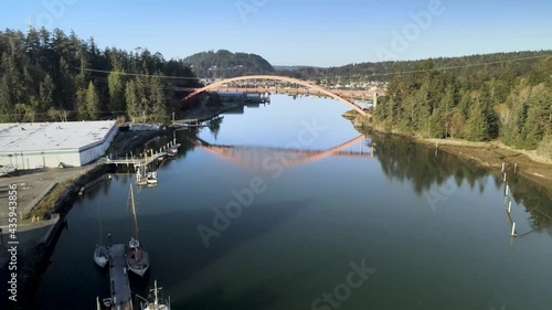 Rising up and revealing the picturesque town of LaConner Washington and the Rainbow Bridge, aerial photo