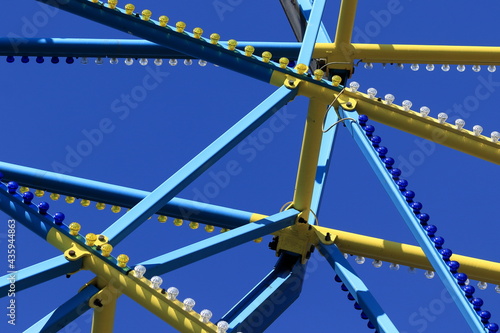 Abstract photography of yellow and blue geometric shapes on a blue background. Technology backgrounds with abstract texture with abstract shapes concept. View up to the blue sky.