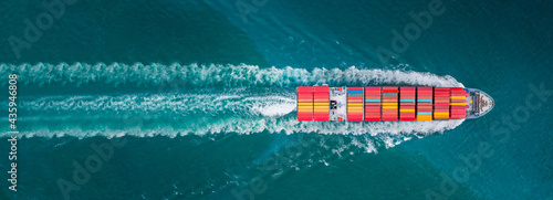 Aerial top view of cargo ship contrail in the ocean sea ship carrying container and running for export from container international port freight shipping by ship service, webinar banner forwarder  © Yellow Boat