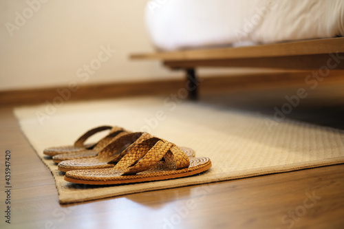 Wicker shoes for use in a hotel bedroom