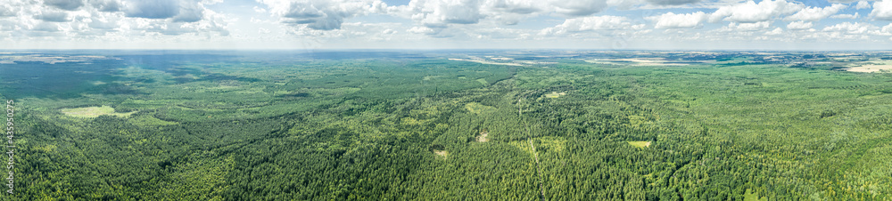 summer rural landscape, panoramic aerial view. big green forest under cloudy sky. Nalibokskaya Forest, Belarus