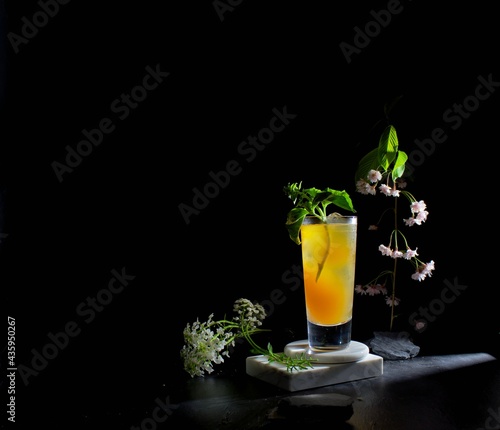 Basil Crush cocktail against a dark moody black background photo