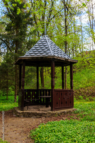 Small wooden gazebo in the Krasnokutsk park, Kharkiv region, Ukraine © olyasolodenko