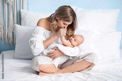 Happy mother and cute littl...
