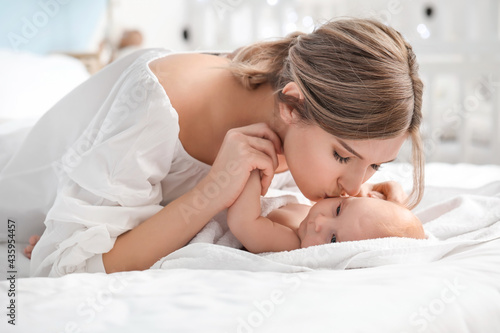 Happy mother and cute littl...