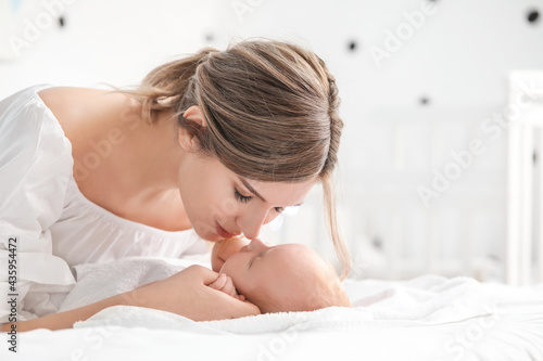 Happy mother and cute littl...