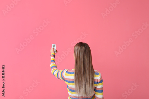 Woman with air conditioner ...
