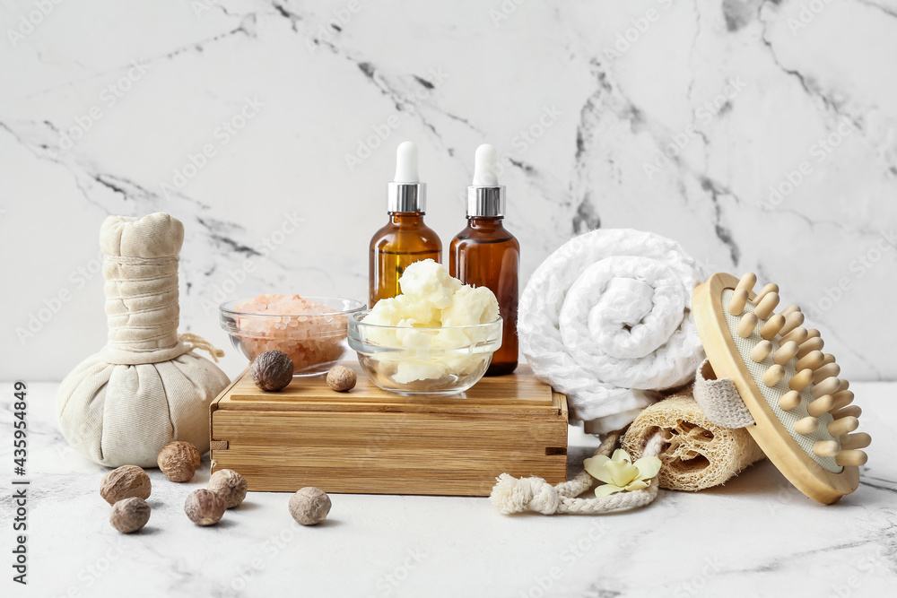 Spa set with shea butter on light background Spa set with shea butter on light background
