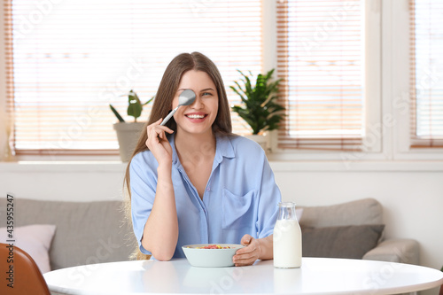 Young woman and bowl with c...