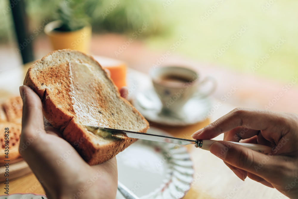 Knife Spreading Butter On Toast Bread In Hands In The Morning Breakfast Coffee And Dessert Concept Stock Photo Adobe Stock