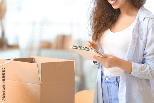 Young woman with parcel and...