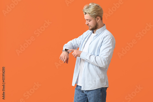 Young man with smart watch ...
