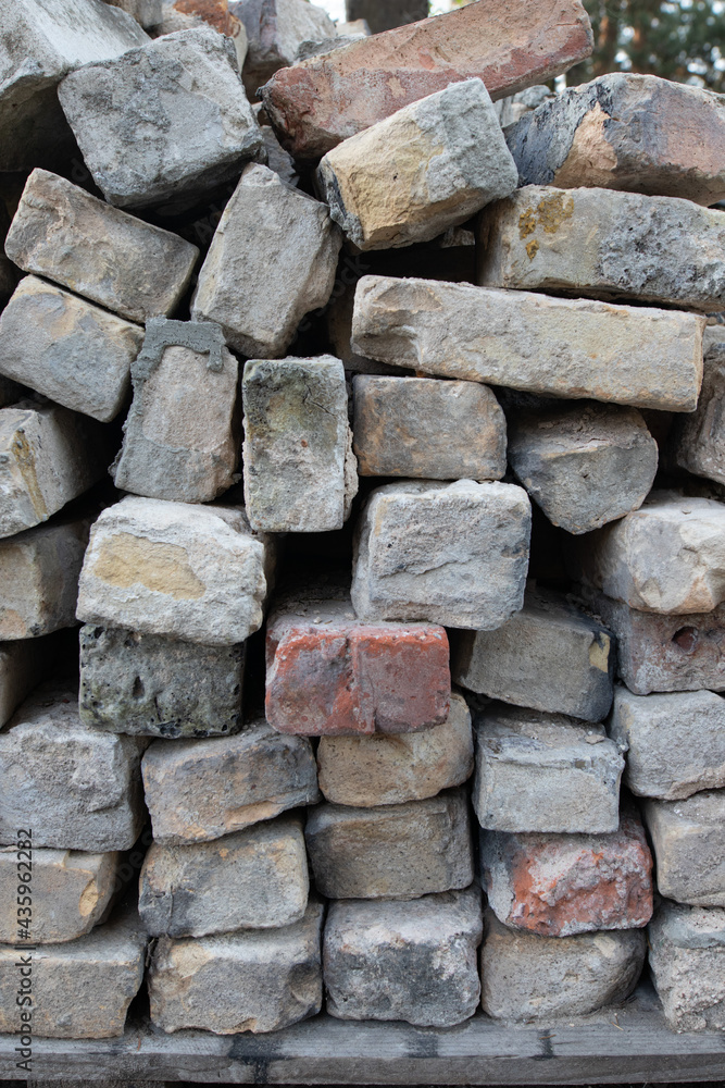 Old Bricks Stacked on top of each other. Chaotic Brick Background Old Bricks Stacked on top of each other. Chaotic Brick Background