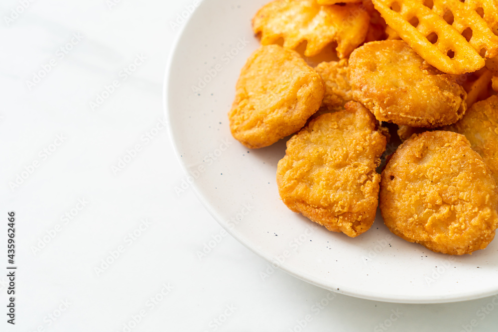 fried chicken nuggets with fried potatoes fried chicken nuggets with fried potatoes