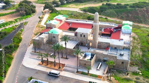 Aerial Panning Shot Of Sidna Ali Mosque In City By Road Over Religious Landmark - Herzliya, Israel photo