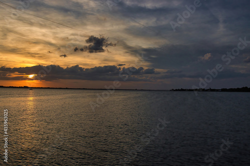 Sunset on a pier in Indialantic Florida on the Indian river © L. Paul Mann