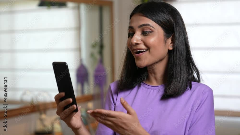 Young Indian woman talking in live streaming video.blogger.Social media.Asian freelance business women casual wear using mobile video call, conference with customer in workplace.Video call on phone. Young Indian woman talking in live streaming video.blogger.Social media.Asian freelance business women casual wear using mobile video call, conference with customer in workplace.Video call on phone.