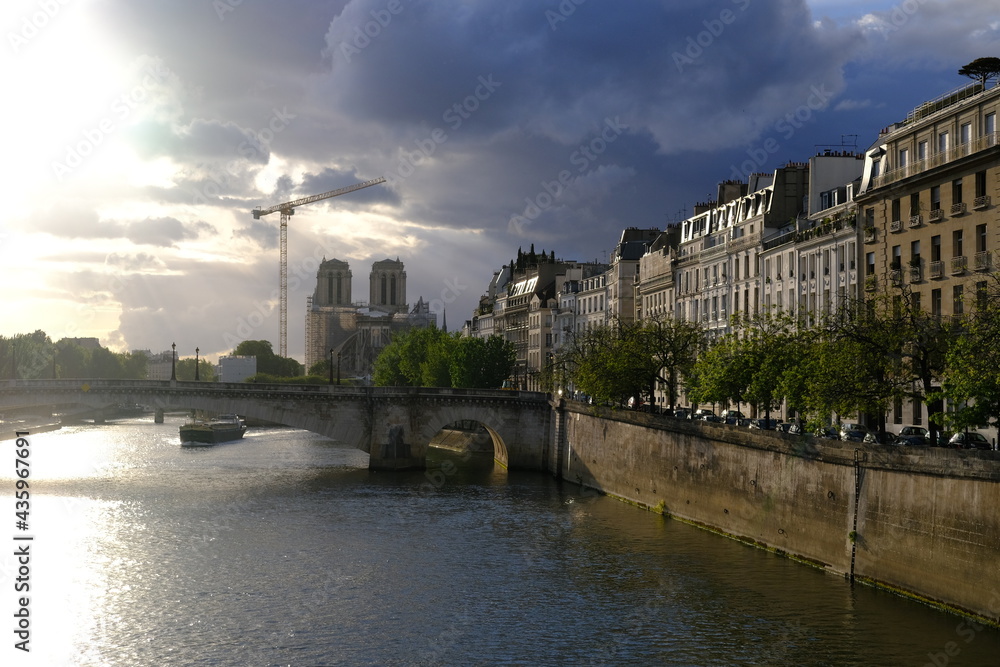 A view on Notre Dame de Paris on a cloudy day. The reconstruction of a devasted cathedral in May 2021, France