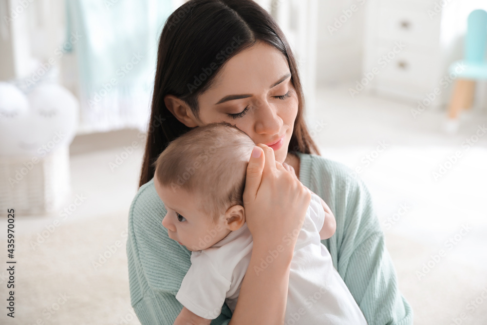 Young woman with her cute baby at home Young woman with her cute baby at home