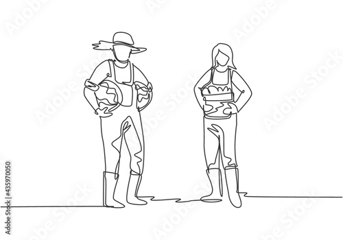 Single one line drawing of couple farmer carrying a basket full of fruit with both they hands from the harvest. Farming minimalism concept. Continuous line draw design graphic vector illustration