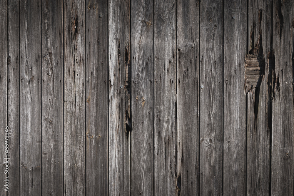 Naklejka premium Old wood siding, faded and distressed background texture