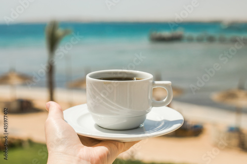 Female hands holding cup of coffee. Good morning sunrise concept. Lets start a new day. Space for text