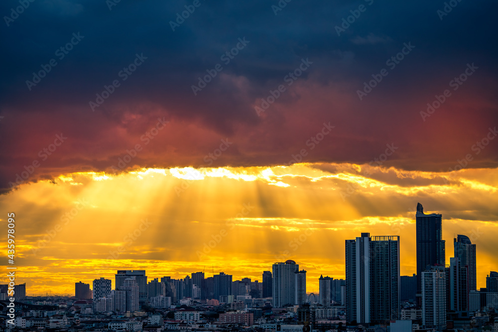 Fototapeta premium The high angle background of the city view with the secret light of the evening, blurring of night lights, showing the distribution of condominiums, dense homes in the capital community