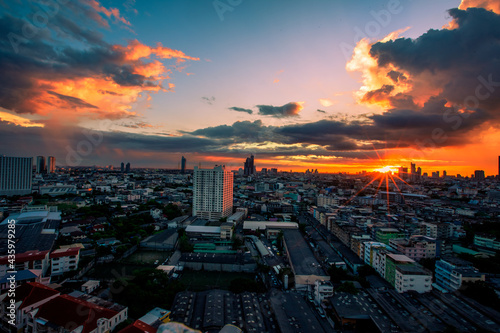 The high angle background of the city view with the secret light of the evening, blurring of night lights, showing the distribution of condominiums, dense homes in the capital community