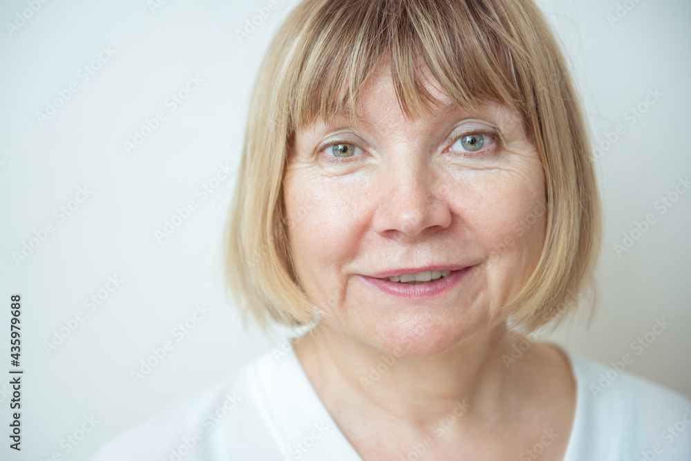 Close up portrait beautiful older woman against white background. Senior Citizen's Day. Caring for the elderly Close up portrait beautiful older woman against white background. Senior Citizen's Day. Caring for the elderly
