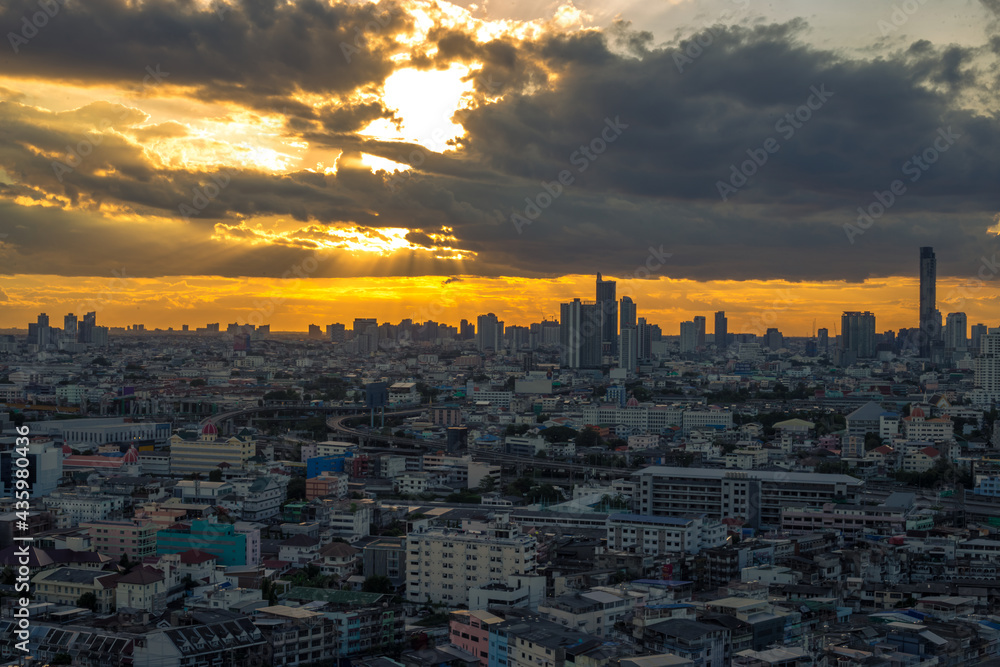 The high angle background of the city view with the secret light of the evening, blurring of night lights, showing the distribution of condominiums, dense homes in the capital community The high angle background of the city view with the secret light of the evening, blurring of night lights, showing the distribution of condominiums, dense homes in the capital community