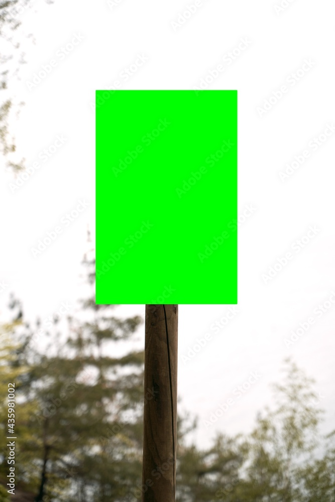 Empty information board on a wooden pole on the forest. Mock up attention sign in national park. Forest warning board. Empty information board on a wooden pole on the forest. Mock up attention sign in national park. Forest warning board.