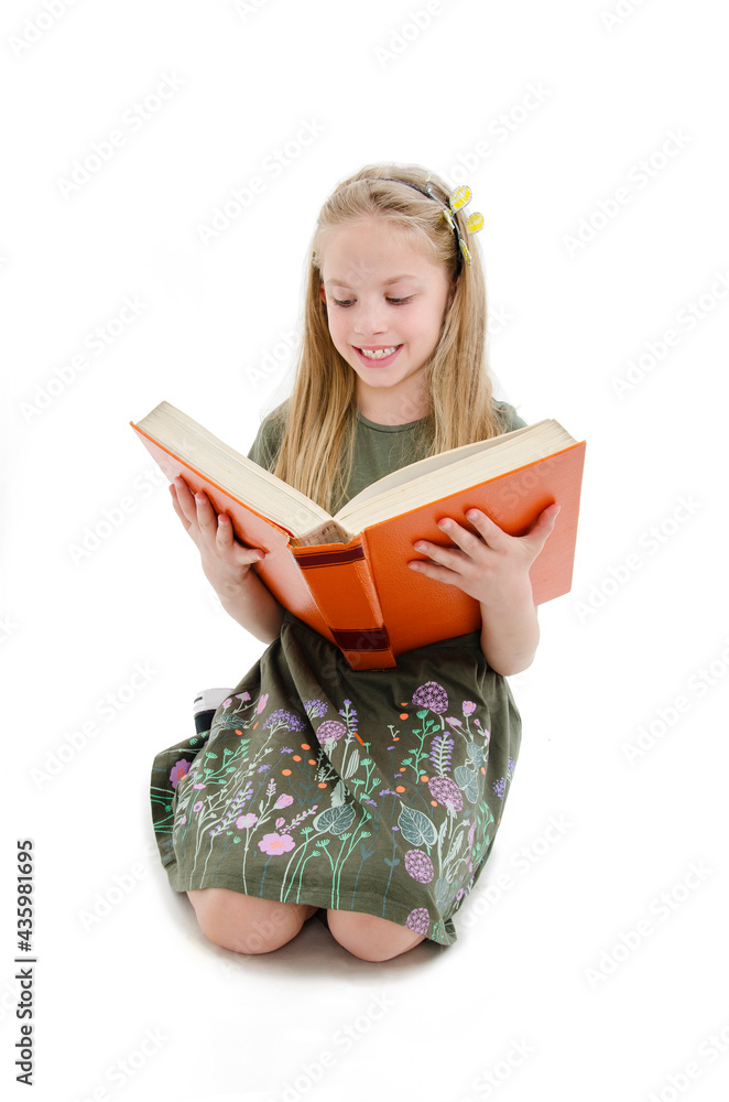 Education and school concept - adorable girl sitting on floor and reading book. Isolated on white background
Education and school concept - adorable girl sitting on floor and reading book. Isolated on white background