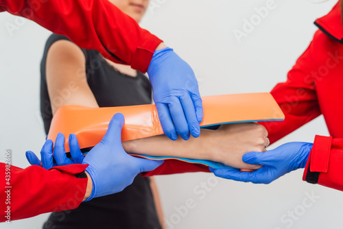 Injury leg. Young man with injured leg. Young woman doctor helps the patient. Close - up. First aid